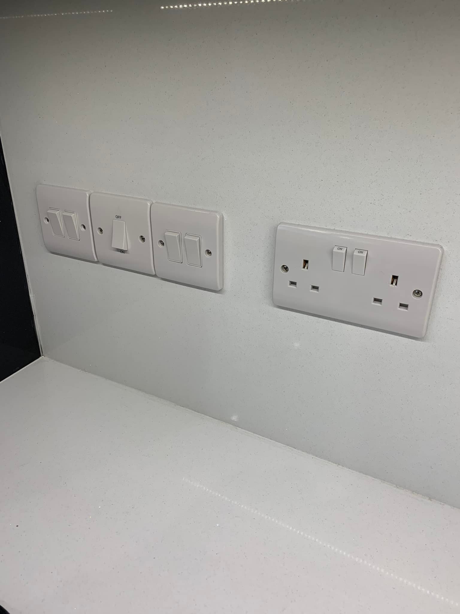Electrical sockets mounted into kitchen wall