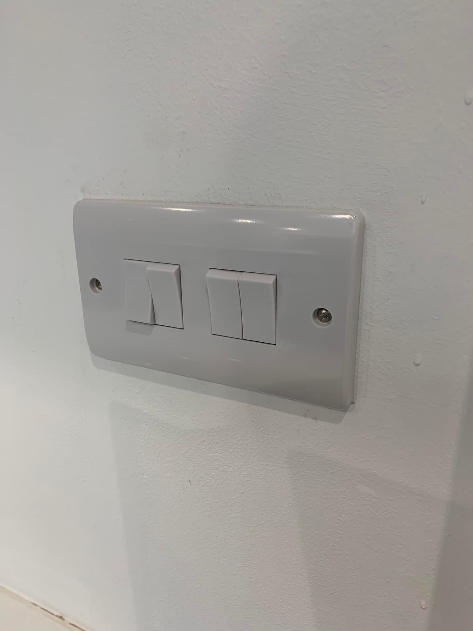 Lightswitches on kitchen wall