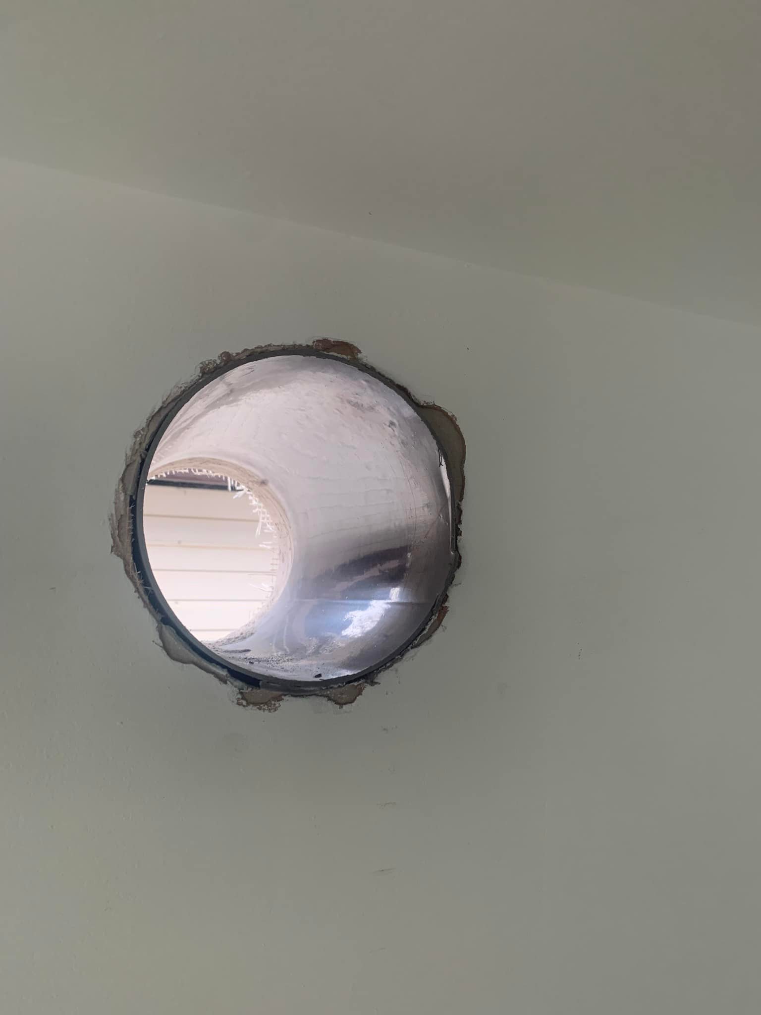 Hole in wall with metal lining