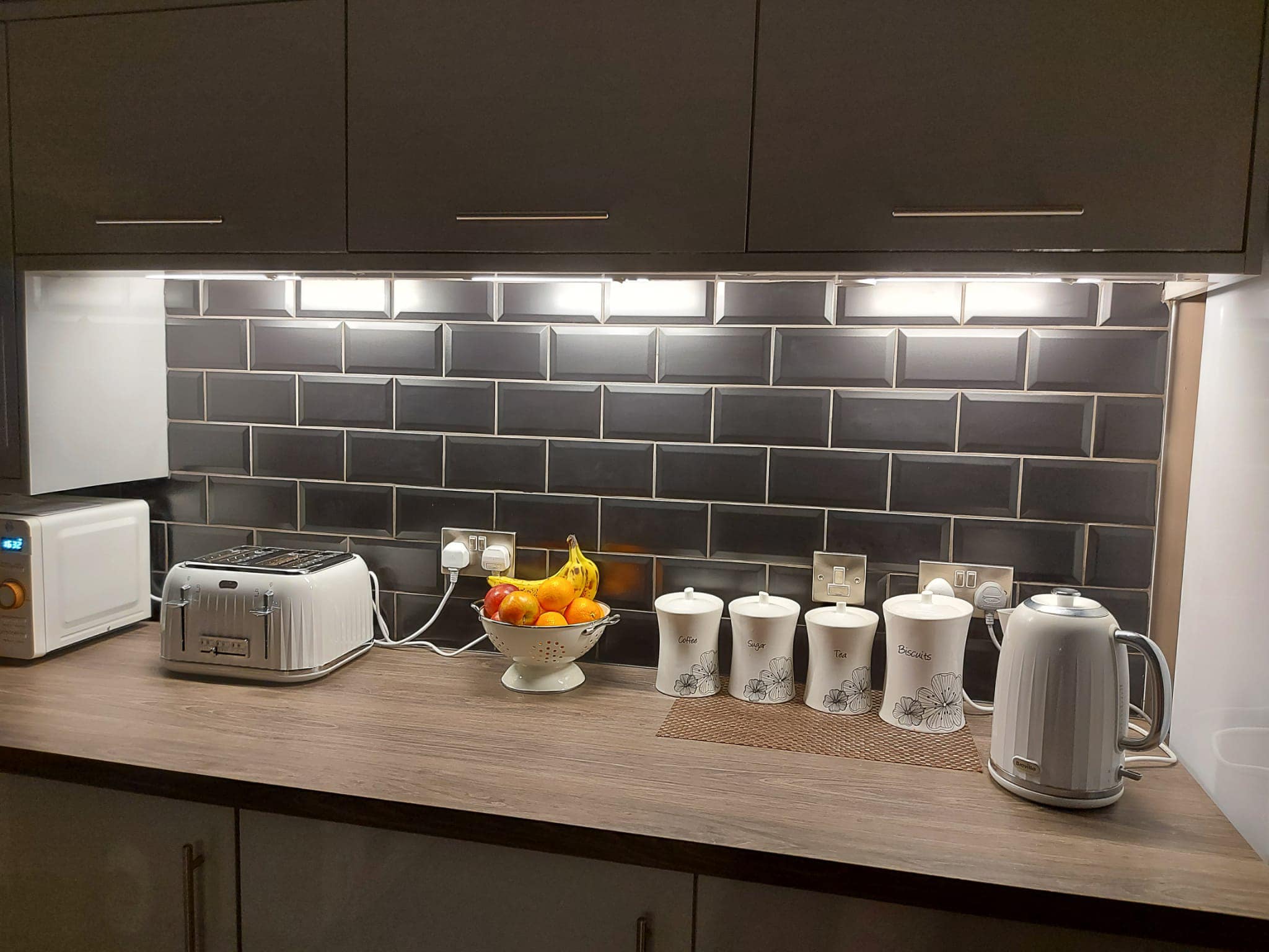 Kitchen surface with under cupboard lighting